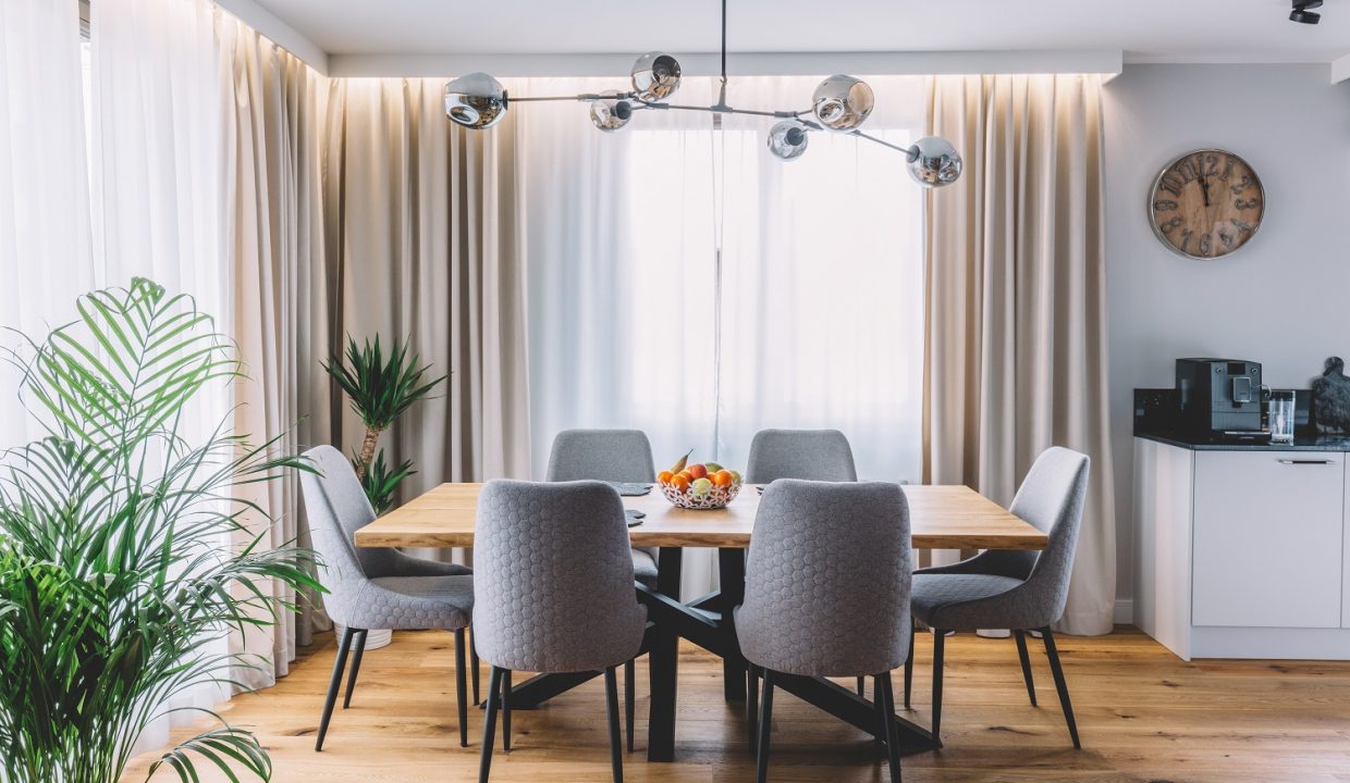 Dining,Room,With,Wooden,Table,And,Floor,In,Modern,Apartment.